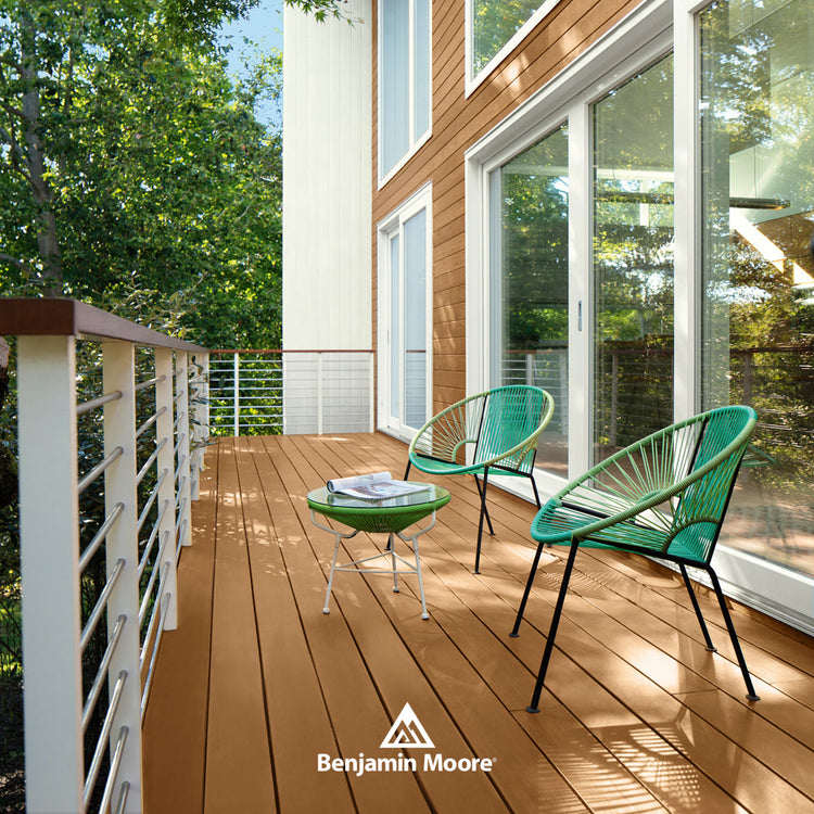 Top down view of striped blue shoes and chair with blue pillow on wooden deck